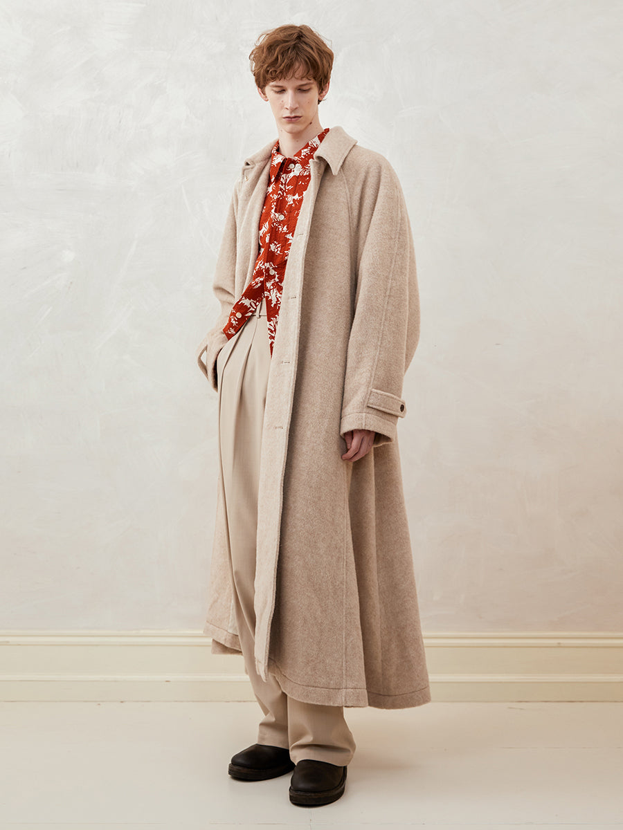 Loose-fitting, drop-shoulder, A-line, long coat with a wide hem